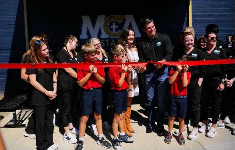 Bietsch Team cutting ribbon